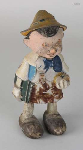 Old composition mechanical toy Pinocchio. Head is