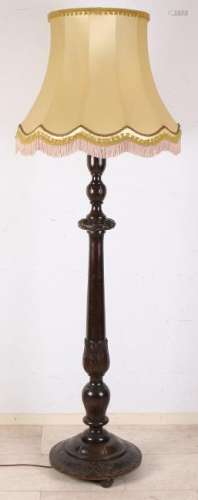 Large wood-stained floor lamp. Darkly stained. Circa