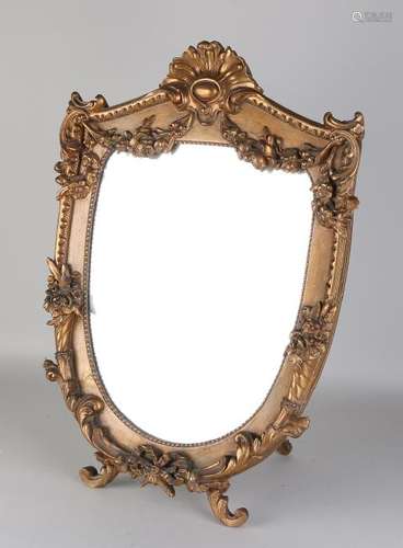 Antique gold-plated Louis Seize mirror with roses.