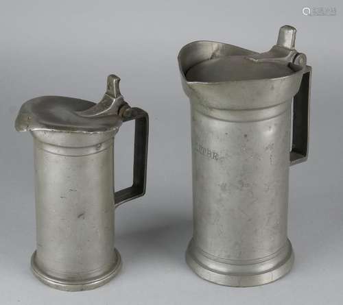 Two 19th century pewter donut jugs. France. Size: 20 -