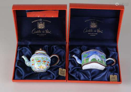 Two limited hand-painted enameled tea pots in a