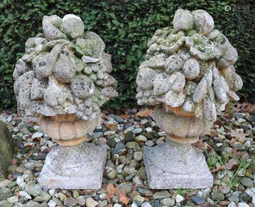 Two concrete molded garden statues in flowerpot form