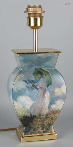 Old brass lamp base with Claude Monet decor. Woman with