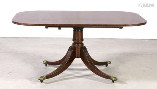 English mahogany dining table with brass claw feet and