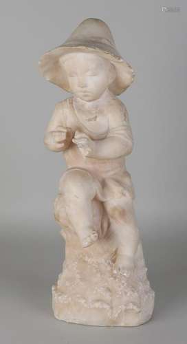 Large antique alabaster figure. Boy with fish on