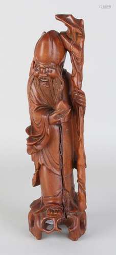 Antique Chinese wood-stuck deity with porcelain eyes.