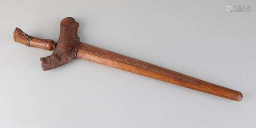 Old Indonesian kris with carved wooden handle and