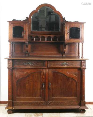 Oak sideboard in Gothic style. Circa 1910. Partly