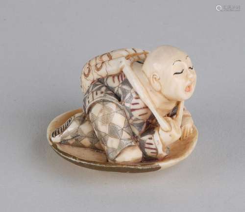 Antique Japanese ivory netsuke. Circa 1900. With soil