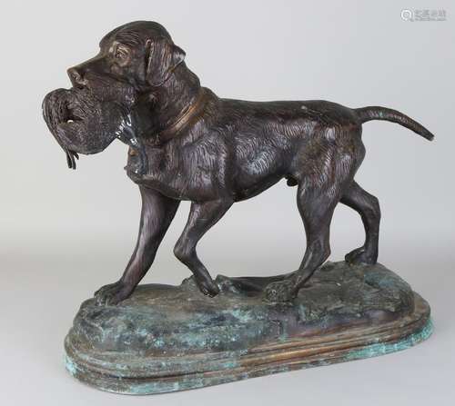 Large bronze hunting dog with bird. Second half of the