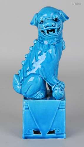 Ancient Chinese porcelain temple lion with blue glaze.