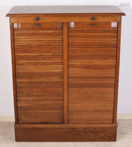 Antique oak double roller shutter filing cabinet. Circa