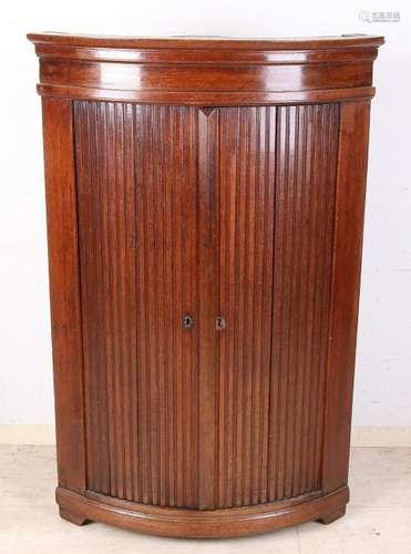 18th Century oak corner cupboard with carved doors.