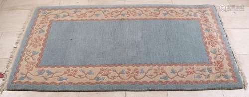 Hand-knotted carpet. Nepal. Light blue in color with a