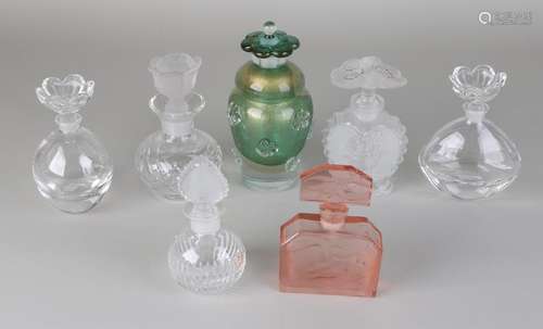 Seven times glass / crystal vials, one of which is pink