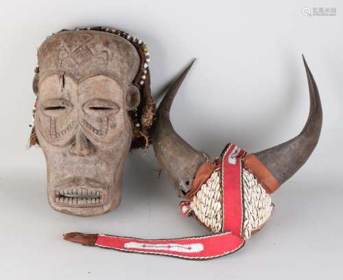 Twice Africa. Consisting of: Wood-stained old mask with