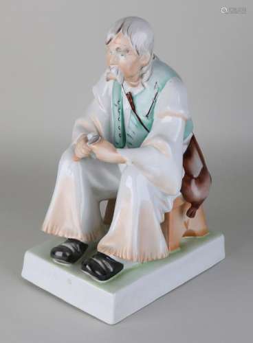 Large old Hungarian porcelain figure. Zsolnay. Man with