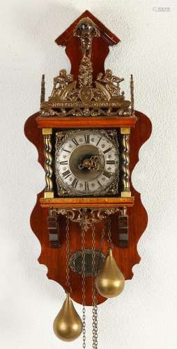 Old Dutch walnut Zaanse clock with bronze ornaments.