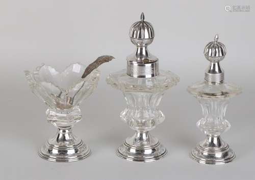 Three-piece crystal table set placed on a silver base