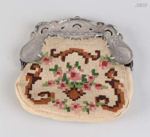 Embroidered bag with silver clip, 833/000, model with