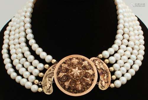 Necklace of pearls with beautiful gold stripe closure,