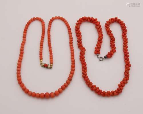 Two strings with blood corals. A necklace with light