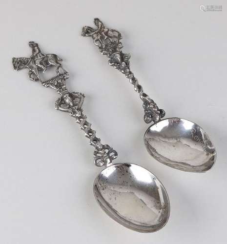 Two silver birth spoons, 835/000, with a double twisted