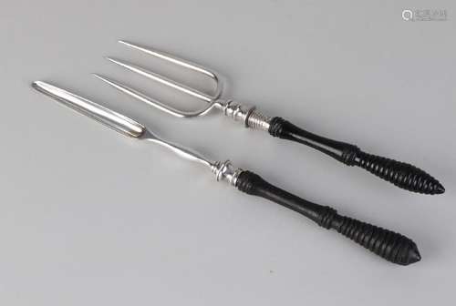 Silver meat fork and marrow drill with ebony handle.