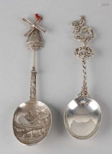 Two silver birth spoons, 835/000, birth spoons with a