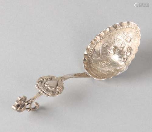 Silver ladle, 835/000, with curled handle crowned with