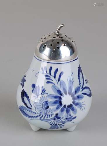 Delft blue hand-painted branded spreader on three legs,