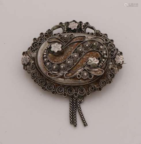 Oval silver regional brooch with S-applique with