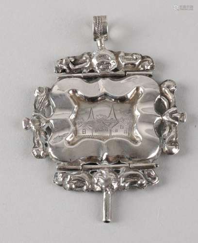 Silver watch key, 833/000, decorated with volutes and