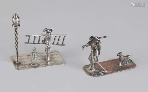 Two miniatures, a silver lantern-lighter, 833/000, and