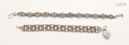 Two silver bracelets, a braided bracelet with soldered