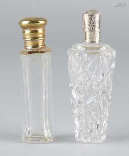 Two crystal odeo vials, one cylindrical model with