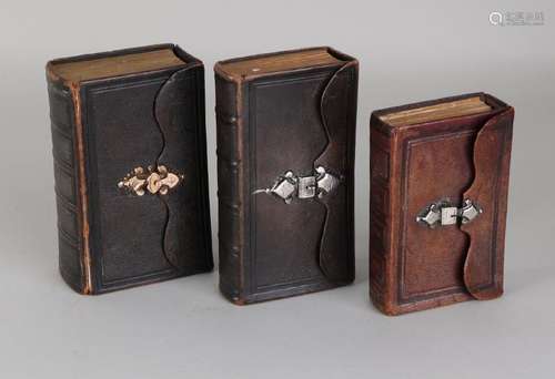 Three antique bibles in brown leather, 2 with a