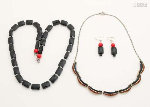 Two necklaces with black stones and a pair of earrings