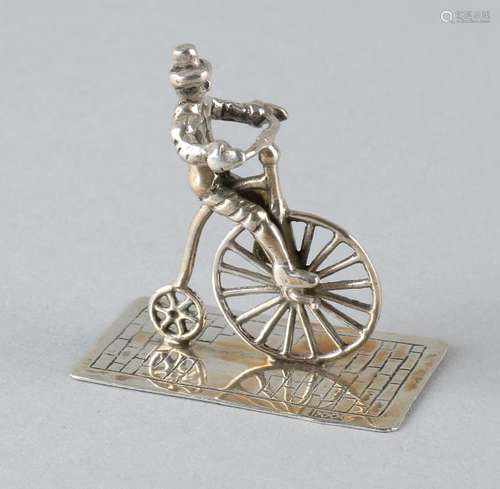 Silver miniature, 835/000, figure on an old bicycle. MT