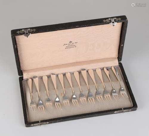 Cassette with 12 silver cake forks, 833/000, model