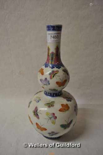 A Chinese polychrome double gourd vase decorated with butterflies, 29cm..