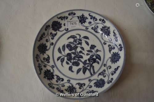 A Chinese blue and white disg decorated with flowers, six character mark to base, 22cm diameter.