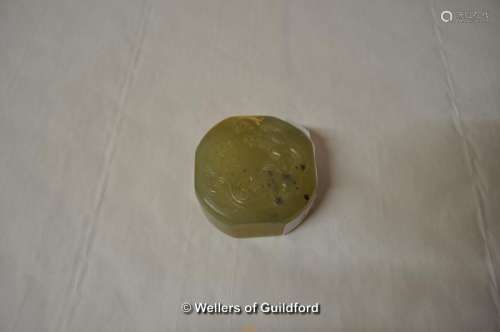 A Chinese jade seal carved with a dragon to the top, chamfered square form, 5cm diameter.