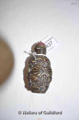A Chinese stone snuff bottle carved all over with fish.