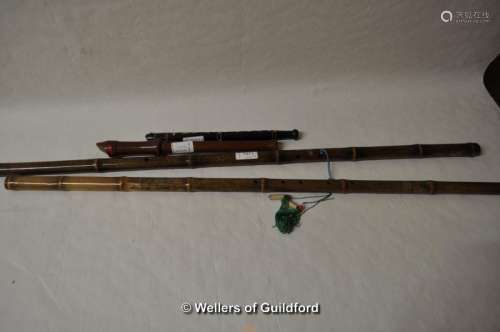 Two Chinese bamboo end flutes, the longest 84.5cm, a small woodwind instrument and a recorder (4).