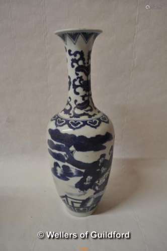 A Chinese blue and white vase with slender neck, decorated with figures in a garden, 31cm.