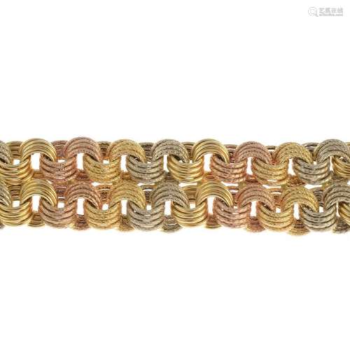 An 18ct gold fancy bracelet. Of tri-colour design,