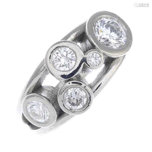 A palladium diamond ring. Of abstract design, the