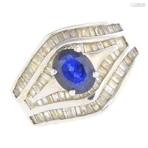 A sapphire and diamond ring. The oval-shape sapphire,