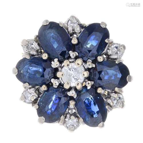 An 18ct gold sapphire and diamond cluster ring. The